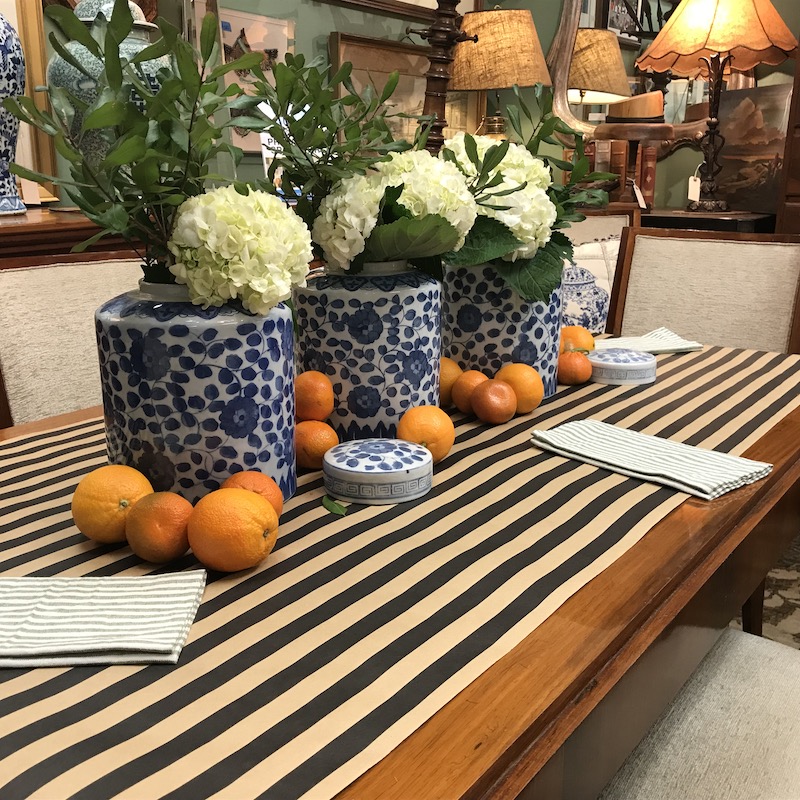 Diane uses a role of heavy striped wrapping paper to create a table runner.